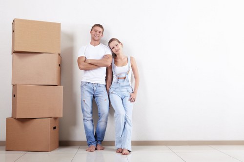 Furniture removal team handling items in a Kentish Town property