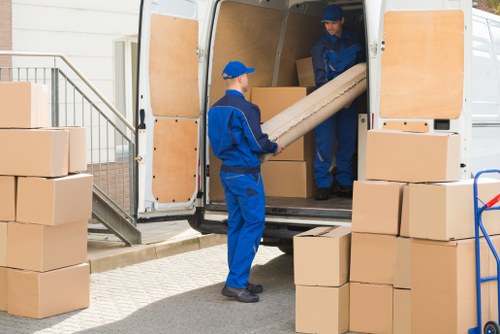 Removal team loading boxes and furniture for a move