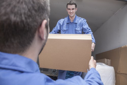 Careful loading of sofas and household furniture into a removal vehicle