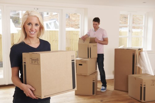 Students preparing boxes for a move in Kentishtown