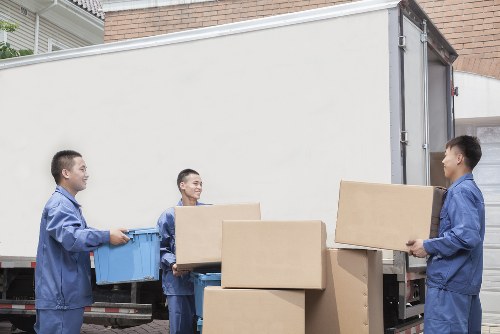 Furniture pick-up service removing bulky sofa in Kentishtown home