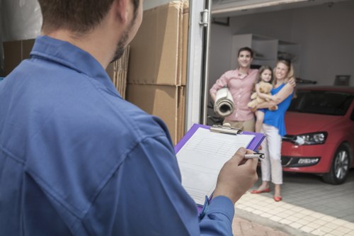 Packed office equipment ready for transport during a commercial move