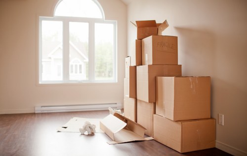 Local furniture movers working around stairs in a Kentish Town flat