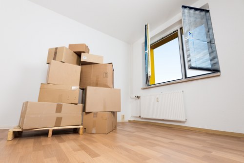 Packed moving boxes and furniture ready for house removals in Kentishtown