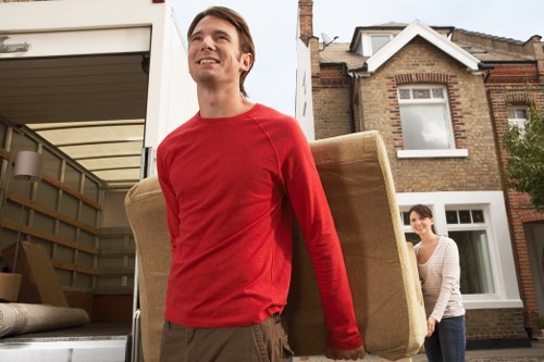 Piano removals team protecting floors and walls during a Kentishtown move