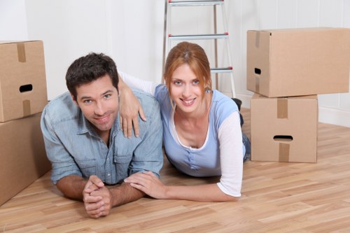 Unpacking support in a Kentish Town flat with boxes arranged room by room