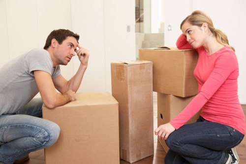 Professional movers handling office furniture during a Kentishtown move
