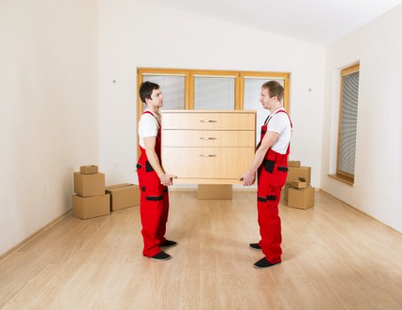 Professional movers loading boxes into a moving truck in Kentishtown
